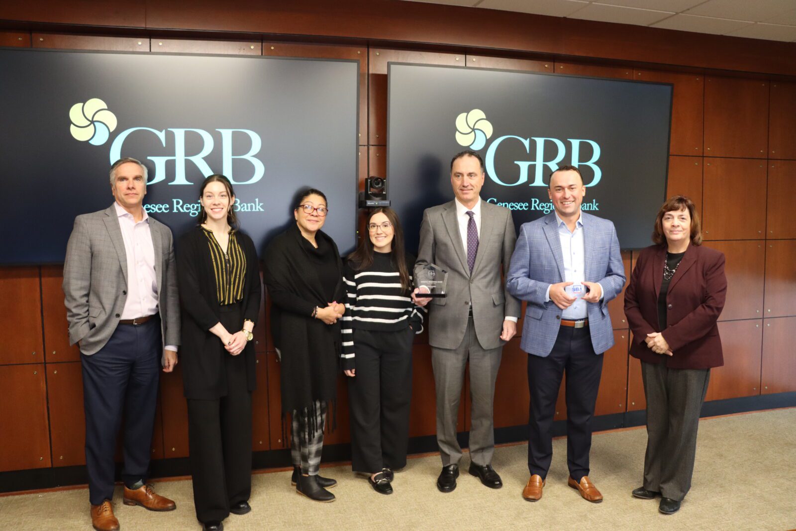 GRB's Commercial Banking team members pose with the 2025 Gold Award from the U.S. Small Business Administration.